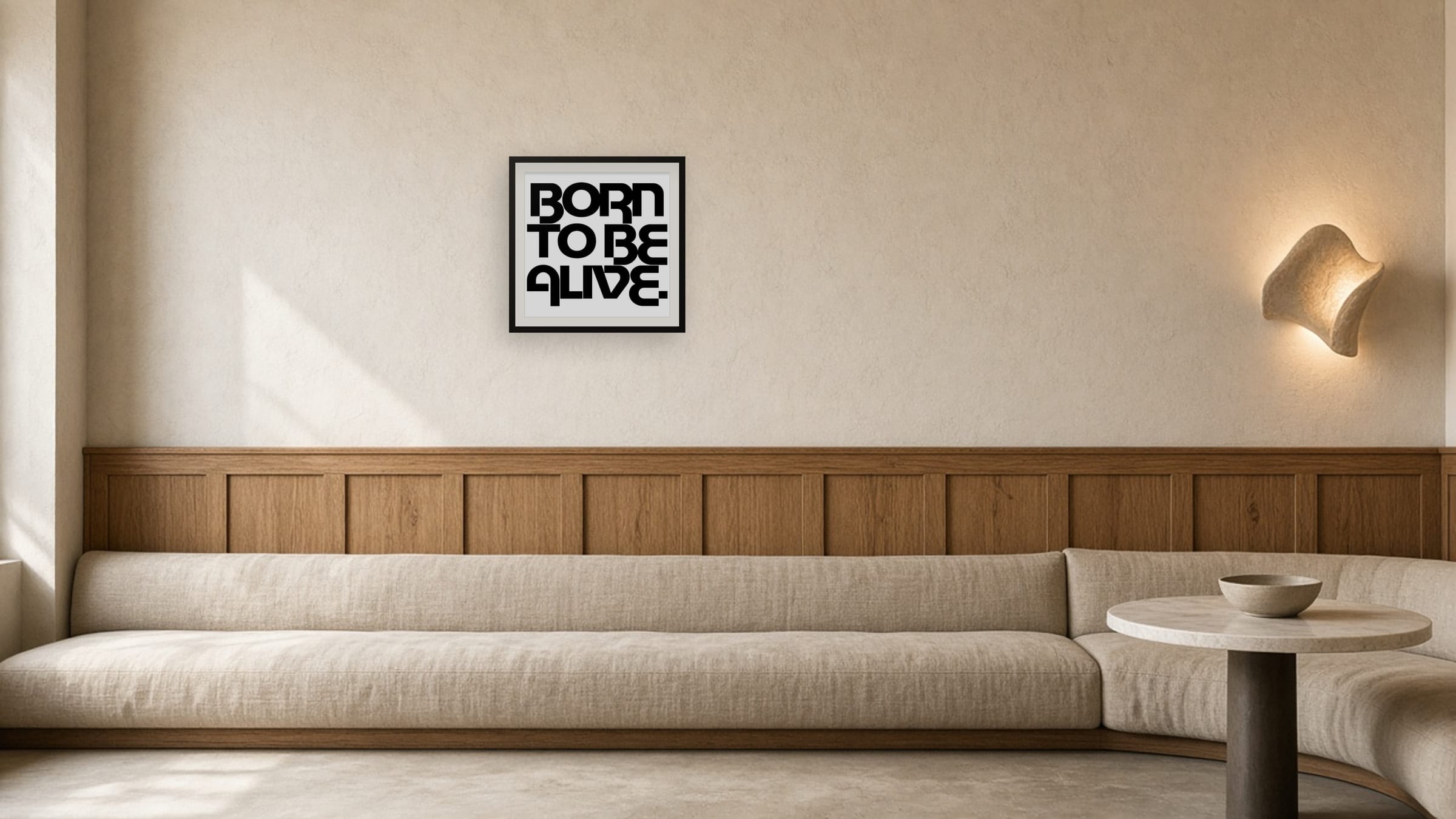 Born To Be Alive framed print above a long linen banquette with oak panelling in a boutique hotel lounge.