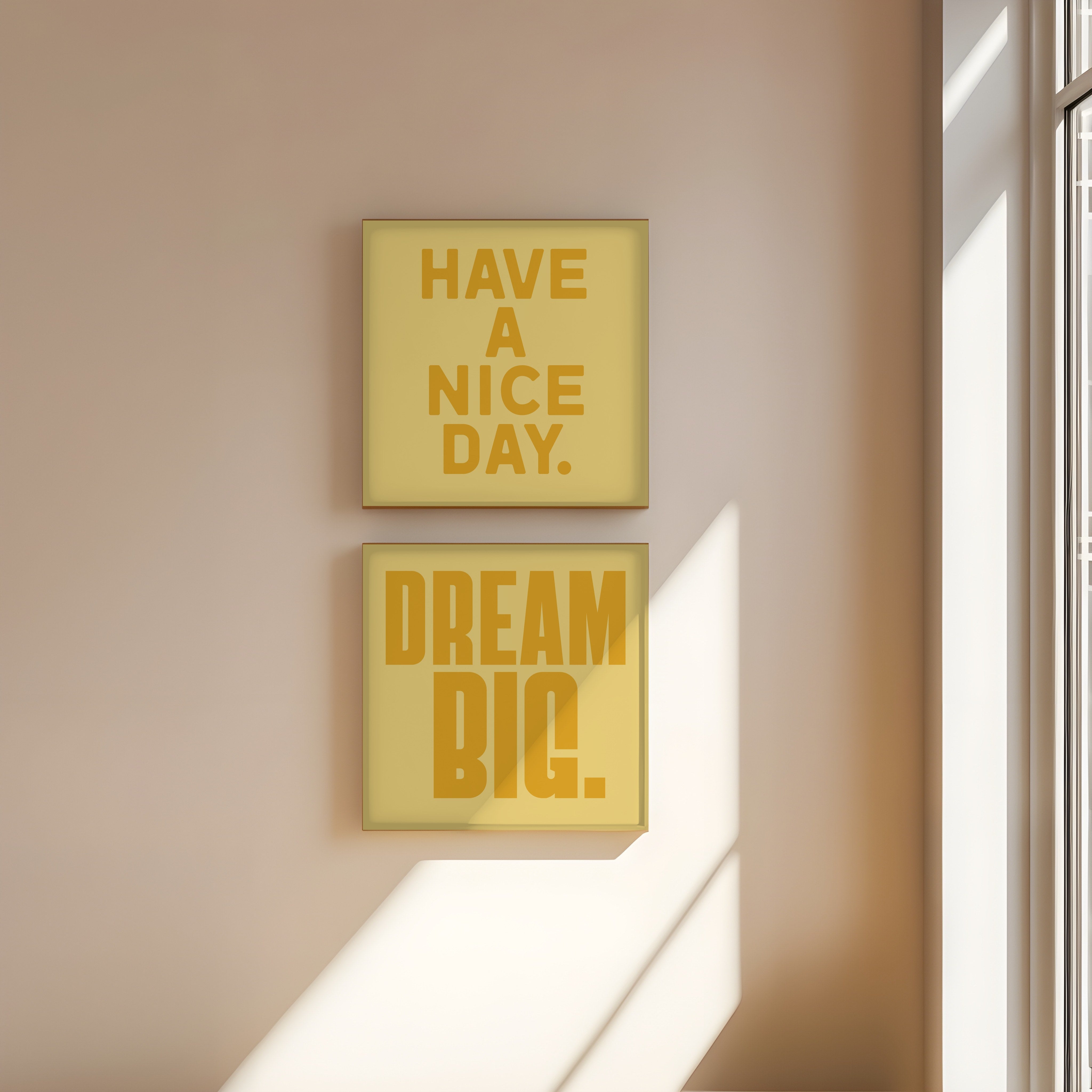 Have a Nice Day and Dream Big, yellow on yellow, in wood frames stacked on a warm wall, prints flush to the wood